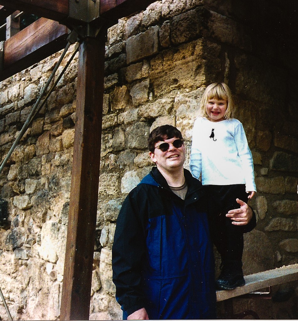 Two people standing in entry way.